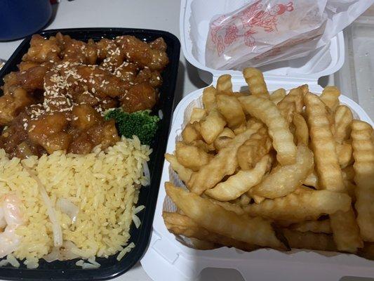 Sesame chicken with shrimp vegetable friend rice. And an order of fries on the side. (came with a free egg roll and soda)