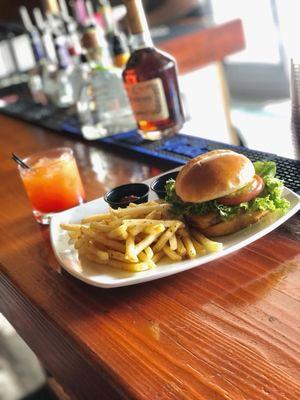 Burger and fries. Plus a specialty drink from our upstairs bar