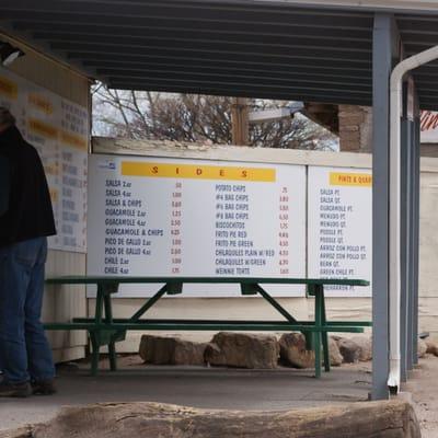 The menu and a picnic table for waiting.