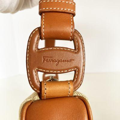 rRepaired ripped leather on strap Ferragamo vintage satchel.