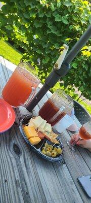 A pitcher of Pink Lemonade and a pitcher of Paper Moon Tea.