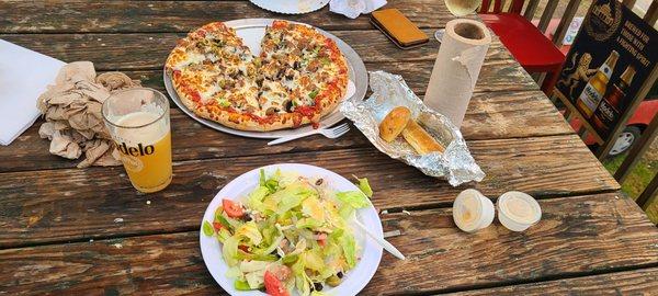 Yummy food from Dans!  The Works pizza and their amazing "small" dinner salad.  perfect evening to enjoy dinner on the deck.  Great place!