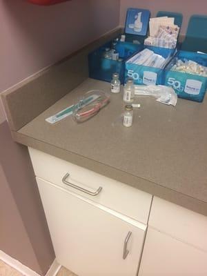 These medical supplies were left out in the open for the half an hour I was waiting to be seen in the treatment room.