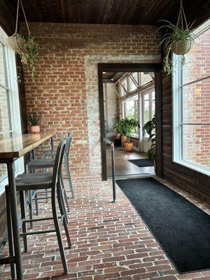 Hallway to larger indoor seating area