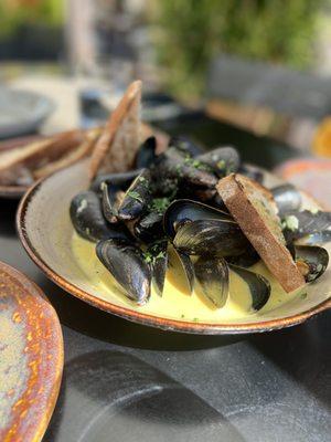 Mussels with delicious coconut milk broth (order extra bread to dip if youre sharing)