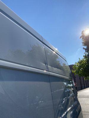 Van had a previous dent and their photo process captured before renting the preexisting condition