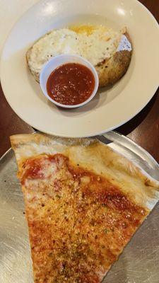 Sliced of Pizza  and the rice ball with sauce.