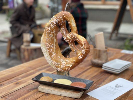 Giant warm pretzel with 3 mustards