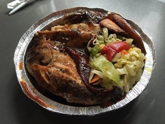 Jerk chicken with barbecue sauce, rice and beans, plantains, and steamed vegetables