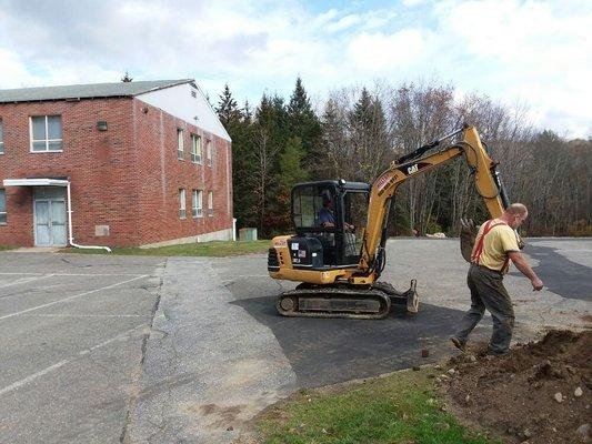 Laying underground drainage pipes for the Church.