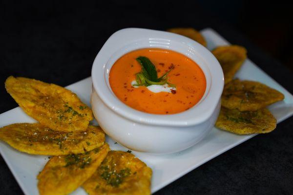 Our famous watermelon, cherry tomato and strawberries gazpacho soup with tostones