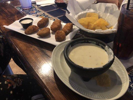 Jalapeño poppers and white Queso.