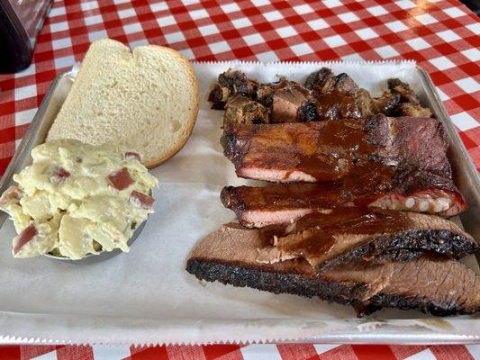 Ribs + burnt ends combo meal with potato salad.