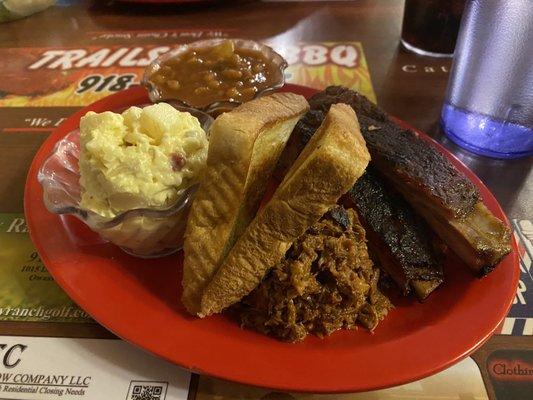 2 meat combo with chopped brisket, ribs, potato salad and baked beans.