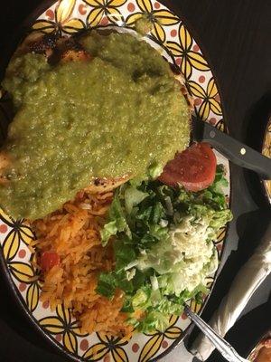 Chicken breast topped with salsa verde with Mexican rice, salad and guacamole.