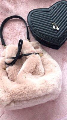 Fur bucket bag and pearl earrings