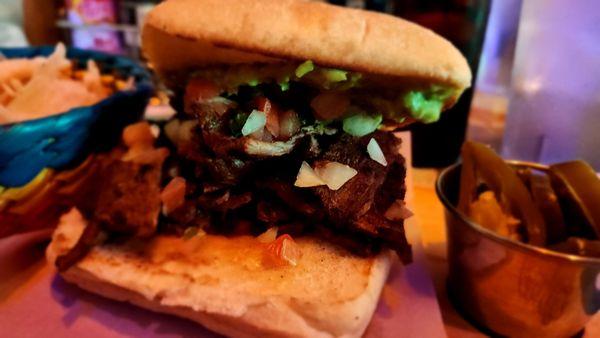 Carne asada tortas sandwich with chips