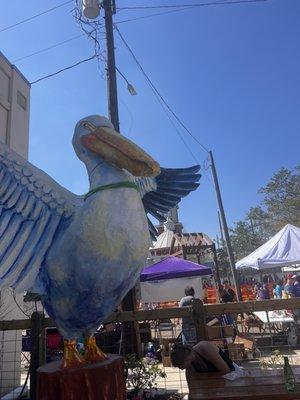 Pelican that welcomes you to his roost in the Covington Beer Garden