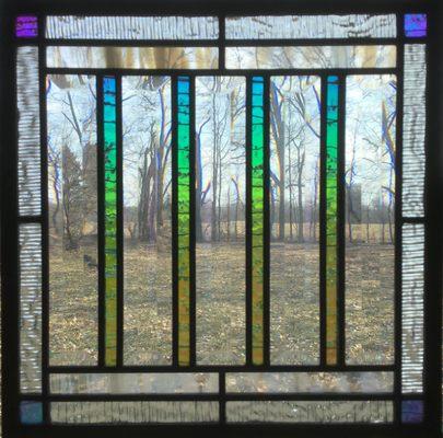 Custom contemporary Arts and Crafts window hanging featuring dichroic and beveled glass