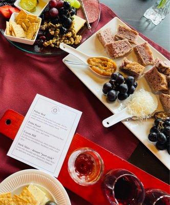 Charcuterie plate, bread plate and red wine flight menu