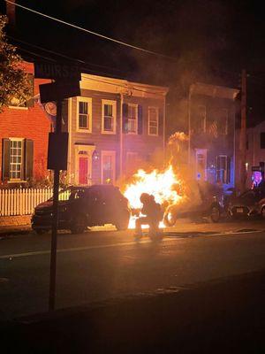 Fire department extinguising car fire less than two hours after work was performed on the car by Baird Automotive