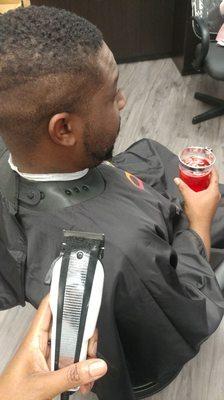 Setting the foundation of a cut while my client enjoys his complimentary vodka soda