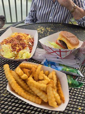 Houseboat salad, cheeseburger, and seasoned fries