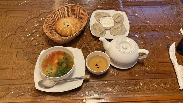 Manti, shura soup, tea, & bread. Delicious try it  Tajikistan's food is quite good.