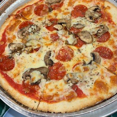 Gluten free pizza with mushrooms and pepperoni