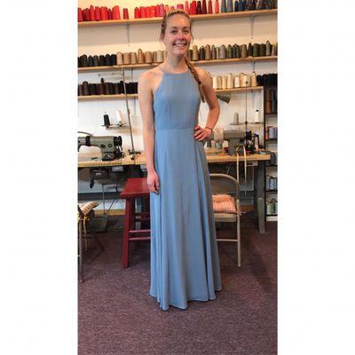 Our client post for us with a big smile after she pick her dress.