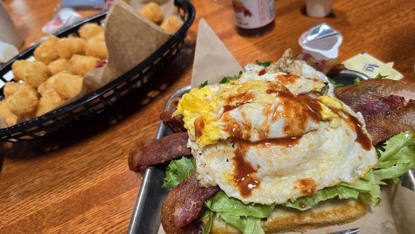 BLT with two fried eggs and a side of tater tots