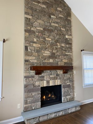 Regency B36XTCE Direct Vent Gas Fireplace accented by custom stone work.