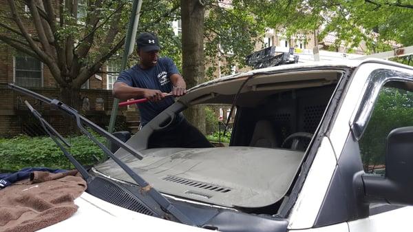 Tyrone getting the frame clean and ready for the new glass on my van.