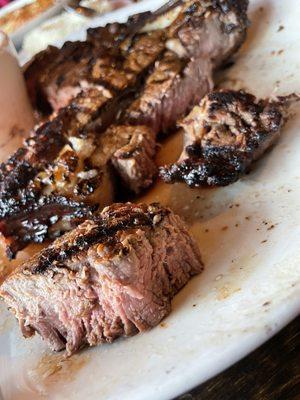 Dry, flavorless, tough.... Sea Cove's pathetic "medium rare" $40 steak. Our server insisted this is medium rare.