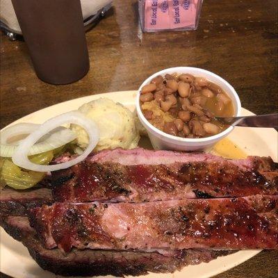 Tucker combo plate with brisket, ribs, rice/beans mix and tater salad.