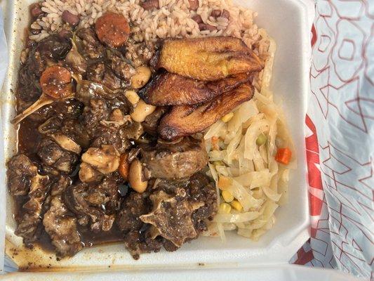 Oxtails, rice and peas, cabbage, fried plantains