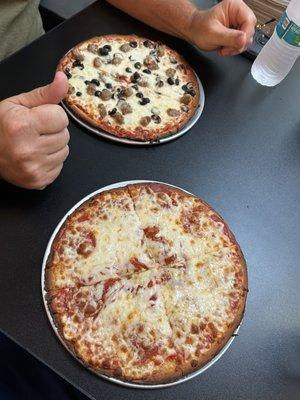 10" gluten Keto & Gluten-Free Personal Pizza- one with sausage and olives and another with barely pepperoni on it.