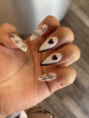 Nails black with hearts and stars