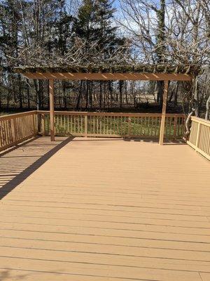 Back deck with new top rails, shored up and sturdy side rails, and fresh coat of paint.