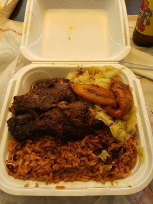 Jerk chicken lunch, comes with cabbage, plaintains, and white rice or rice and peas