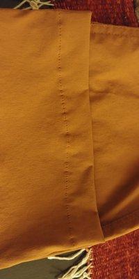 Hemmed orange pants