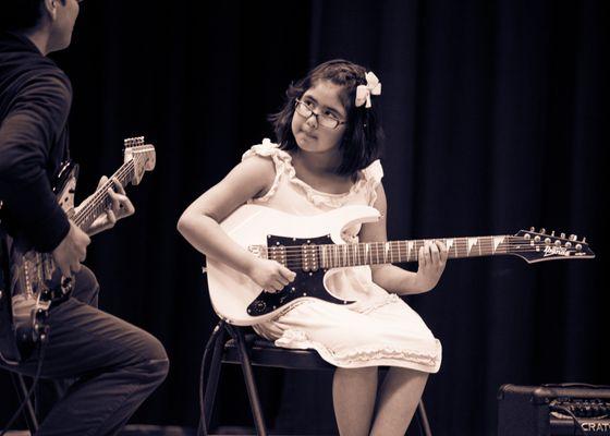 California Guitar Academy student performs at her first recital.