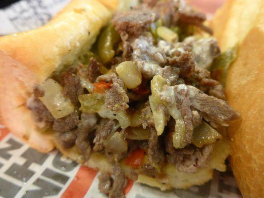 Go east coast with their Cheese Steak with grilled steak, melted white American cheese, fried onions, hot and sweet peppers.