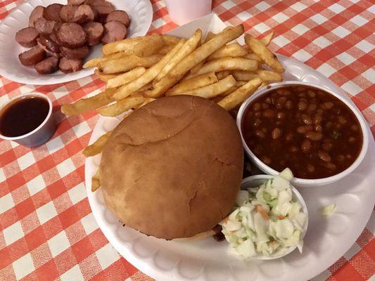 Half pound of sausage and jumbo pork sandwich special with baked beans and fries