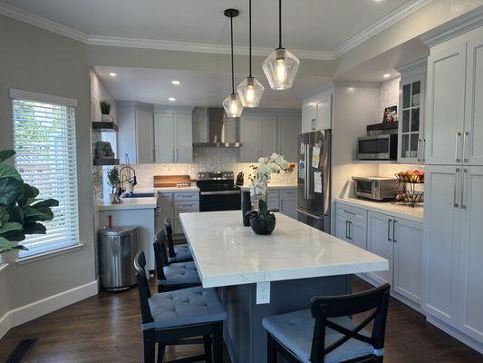 Dining and kitchen- what a big change with cabinet touch up and new chandelier!