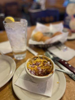 Beanless chili with cheese and onions on top