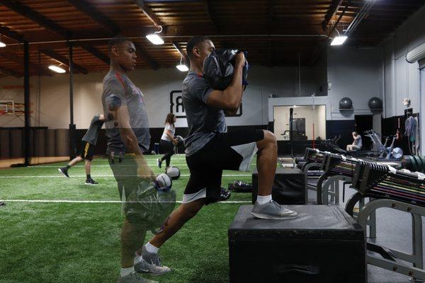 Progression of sand bag hang clean variation done by Activ8 Athlete, Armand. Focusing on power production.