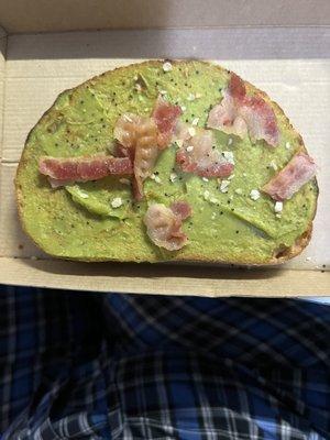 Avocado toast with less than a half slice of bacon!