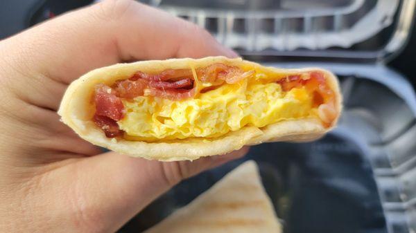 Egg & Cheddar wrap with bacon. The eggs look and tasted like powered eggs.