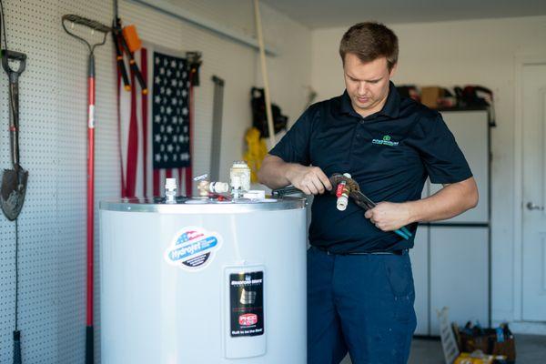 Installation of a tank style water heater.